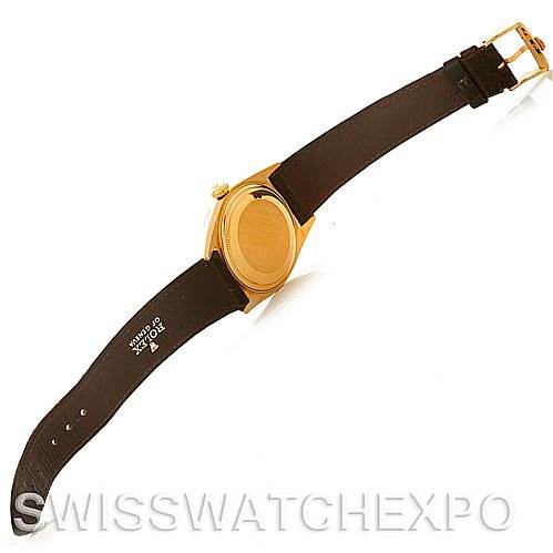 This image shows the back side of a Rolex President 1803 Men's Yellow Gold Champagne Dial 1803 Men's Yellow Gold Champagne Dial model watch with its leather strap fully extended.