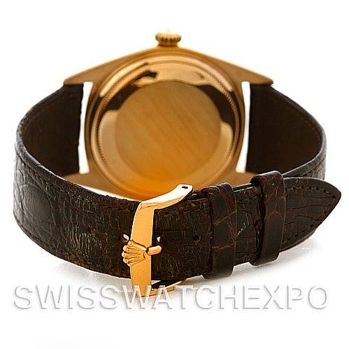 This image shows the back of the Rolex President 1803 Men's Yellow Gold Champagne Dial 1803 Men's Yellow Gold Champagne Dial model watch, including the case back and leather strap with a gold buckle.