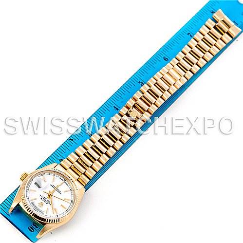 This image shows a Rolex President 18038 Men's Yellow Gold White Dial 18038 Men's Yellow Gold White Dial watch laid flat against a blue ruler, displaying the full bracelet and face.