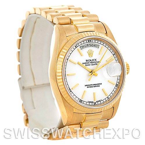 This is a President model Rolex watch shown at an angled view, featuring its gold band and white dial.