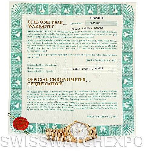 The image shows a Rolex President 18038 Men's Yellow Gold White Dial 18038 Men's Yellow Gold White Dial model watch placed on an official warranty and chronometer certification document.