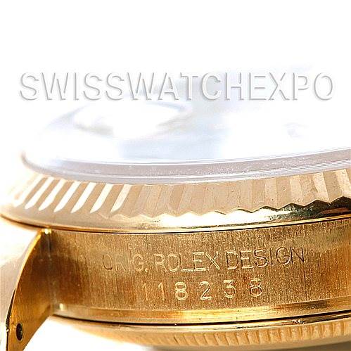 This image shows a close-up side view of a Rolex President 118238 Men's Yellow Gold White Dial 118238 Men's Yellow Gold White Dial model watch, highlighting the bezel and engraved case side.