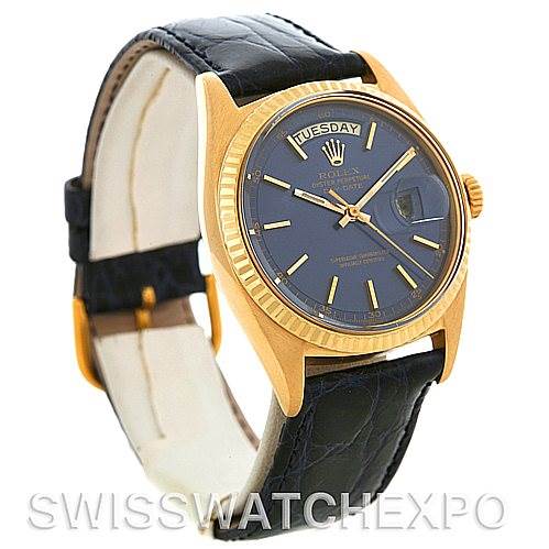 The image shows a side-front view of a Rolex President 1803 Men's Yellow Gold Blue Dial 1803 Men's Yellow Gold Blue Dial watch, highlighting its black leather strap, gold casing, and day-date display.