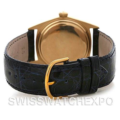 This image shows the back of a Rolex President 1803 Men's Yellow Gold Blue Dial 1803 Men's Yellow Gold Blue Dial watch, highlighting its gold case and black leather strap.