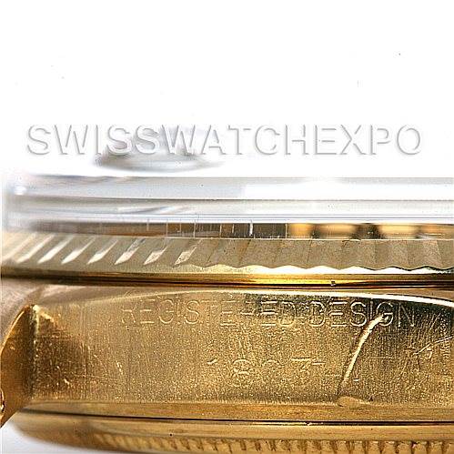 This image shows a close-up side view of a Rolex President 1803 Men's Yellow Gold Blue Dial 1803 Men's Yellow Gold Blue Dial model, focusing on the case and bezel with engravings visible.