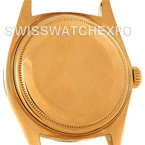 The image shows the back case of the Rolex President 1803 Men's Yellow Gold Blue Dial 1803 Men's Yellow Gold Blue Dial model watch in a close-up view.