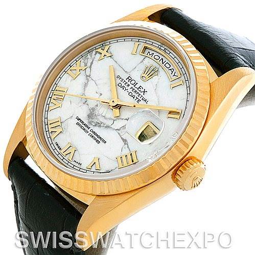 The image shows a Rolex President 18238 Men's Yellow Gold Grey Dial 18238 Men's Yellow Gold Grey Dial model watch from an angled side view, highlighting the marble dial, fluted bezel, and leather strap.