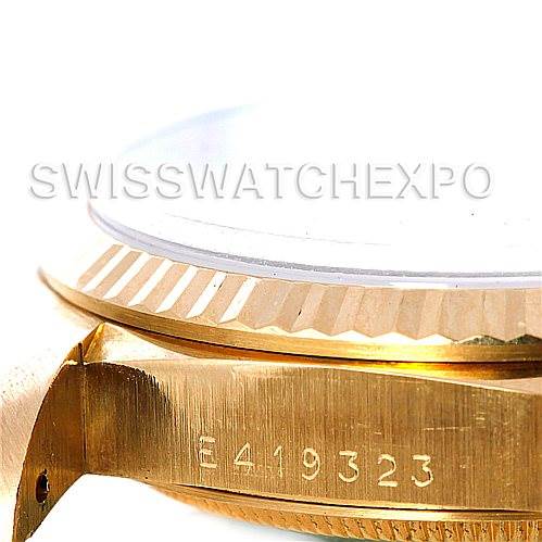 This angled shot of the Rolex President 18238 Men's Yellow Gold Grey Dial 18238 Men's Yellow Gold Grey Dial model shows the side view of the watch case and part of the bezel, focusing on the serial number.