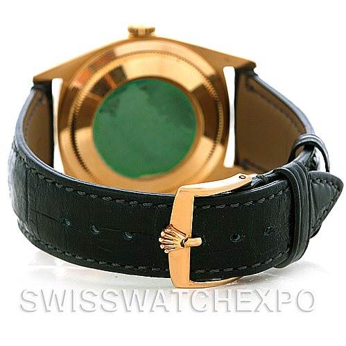 The image displays the backside of a Rolex President 18238 Men's Yellow Gold Grey Dial 18238 Men's Yellow Gold Grey Dial model watch, showing its case and black leather strap with a gold buckle.