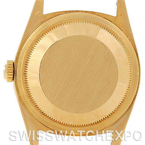 This image shows the back case and the crown of a Rolex President 18248 Men's Yellow Gold Black Dial 18248 Men's Yellow Gold Black Dial model watch.
