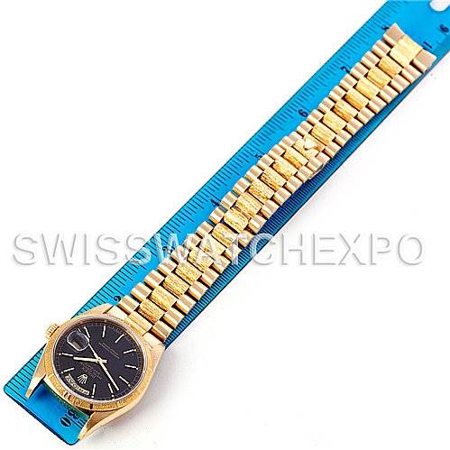 The image shows the entire Rolex President 18248 Men's Yellow Gold Black Dial 18248 Men's Yellow Gold Black Dial watch, including the dial, case, and bracelet, laid flat next to a ruler.