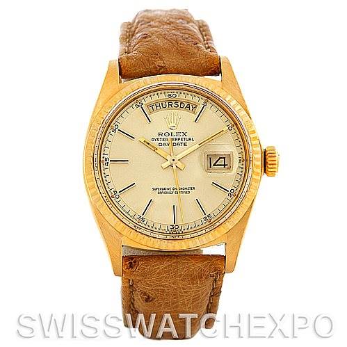 The image shows a frontal view of the Rolex President 1803 Men's Yellow Gold Champagne Dial 1803 Men's Yellow Gold Champagne Dial Day-Date watch, featuring its dial, bezel, and leather strap.