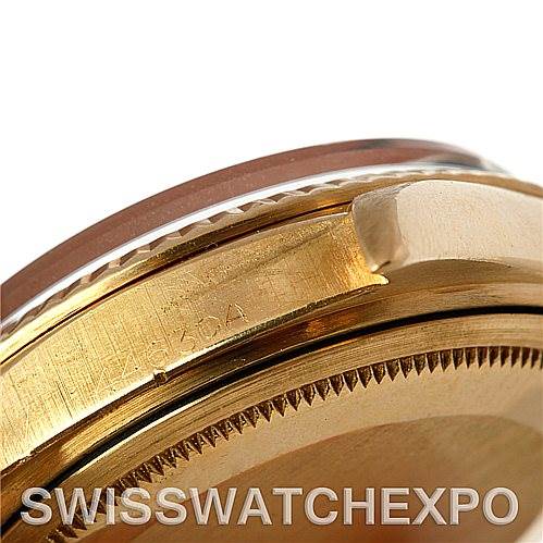 This image shows a close-up of the side and partial bezel of a Rolex President 1803 Men's Yellow Gold Blue Dial 1803 Men's Yellow Gold Blue Dial model watch, highlighting the engraved serial number. The bracelet and dial are not visible.