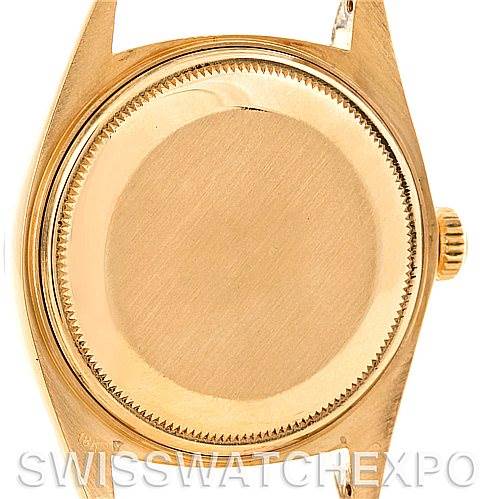 This image shows the back case of a Rolex President 1803 Men's Yellow Gold Champagne Dial 1803 Men's Yellow Gold Champagne Dial model watch, focusing on the case back and crown from a straight-on angle.