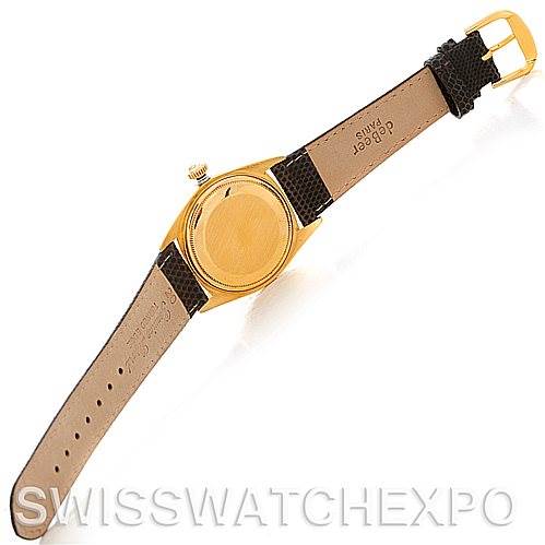 The image shows the backside of a Rolex President 1803 Men's Yellow Gold Champagne Dial 1803 Men's Yellow Gold Champagne Dial model watch, displaying its case back and leather strap.