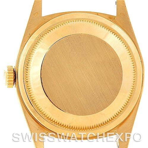 This image shows the back case and crown of a Rolex President 18248 Men's Yellow Gold Champagne Dial 18248 Men's Yellow Gold Champagne Dial watch from a top-down angle.