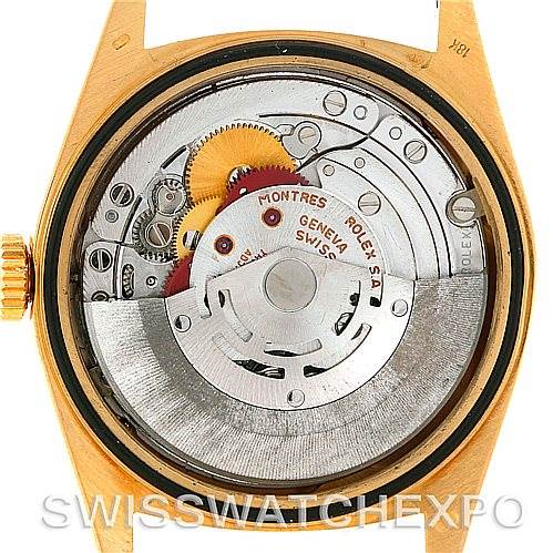 The image shows the open case back of a Rolex President 18248 Men's Yellow Gold Champagne Dial 18248 Men's Yellow Gold Champagne Dial model watch, exposing its internal mechanics and movement.