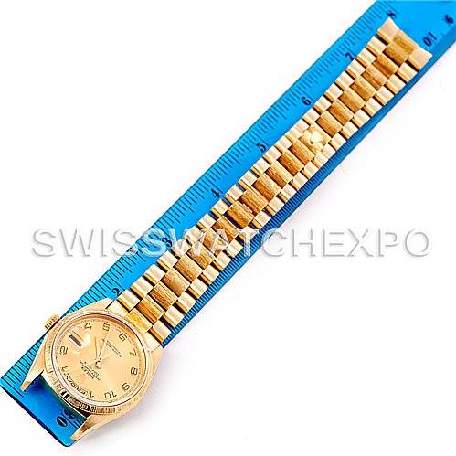 The image shows a Rolex President 18248 Men's Yellow Gold Champagne Dial 18248 Men's Yellow Gold Champagne Dial model watch laid flat with a blue ruler next to it for measurement.
