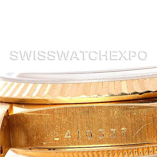 This image shows a close-up of the side case, serial number, and fluted bezel of a Rolex President 18238 Men
s Yellow Gold Champagne Dial 18238 Men
s Yellow Gold Champagne Dial model watch.