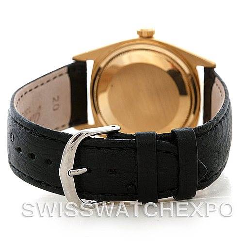 This image shows a back view of a Rolex President 1803 Men's Yellow Gold Black Dial 1803 Men's Yellow Gold Black Dial model watch, highlighting its black leather strap and gold case.