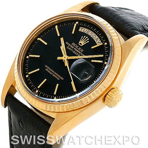 This image shows a Rolex President 1803 Men's Yellow Gold Black Dial 1803 Men's Yellow Gold Black Dial model watch from a three-quarter angle, highlighting its black dial, gold case, and crown with a leather strap.