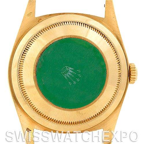 This image shows the back case of a Rolex President 18238 Men
s Yellow Gold Champagne Dial 18238 Men
s Yellow Gold Champagne Dial model watch, focusing on the caseback and crown.