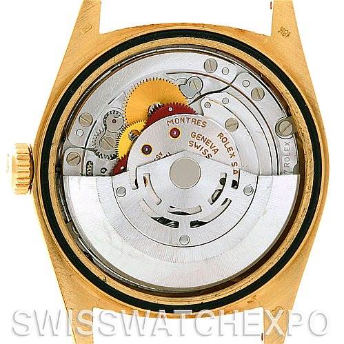 This image shows the internal mechanism of a Rolex President 18238 Men
s Yellow Gold Champagne Dial 18238 Men
s Yellow Gold Champagne Dial model watch from the back, highlighting gears and movement components.