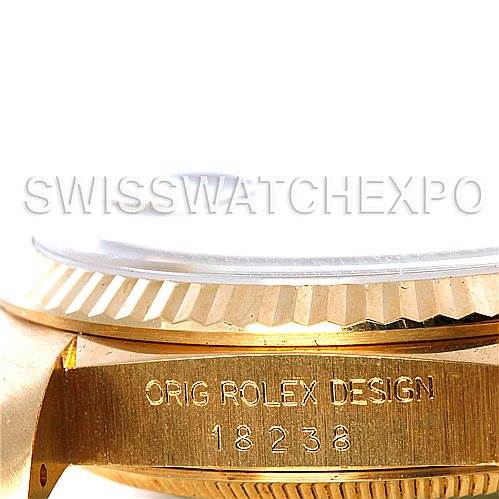 This image shows a close-up side view of the case and bezel of a Rolex President 18238 Men
s Yellow Gold Champagne Dial 18238 Men
s Yellow Gold Champagne Dial model watch, highlighting the engraving.