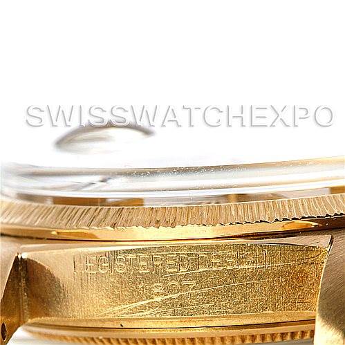 This close-up image of the Rolex President 1807 Men's Yellow Gold Champagne Dial 1807 Men's Yellow Gold Champagne Dial watch focuses on the side case and the edge of the bezel, displaying engraved details.