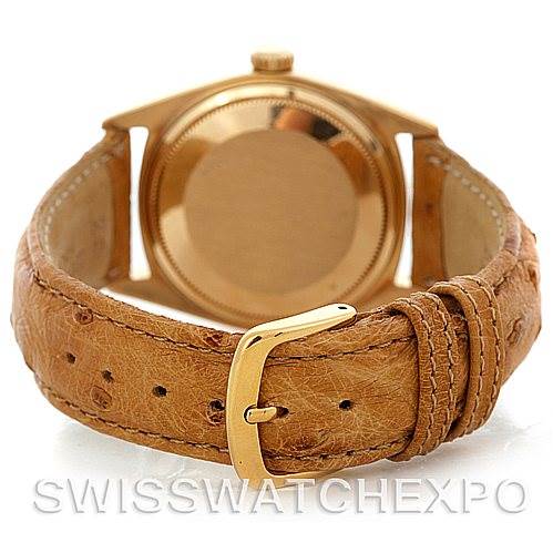 The image shows the back of a Rolex President 1807 Men's Yellow Gold Champagne Dial 1807 Men's Yellow Gold Champagne Dial model watch with a beige leather strap, viewed from the case-back side with the buckle visible.