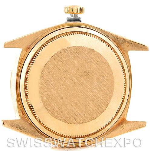 This image shows the back case and crown of a Rolex President 1807 Men's Yellow Gold Champagne Dial 1807 Men's Yellow Gold Champagne Dial model watch from a rear angle.
