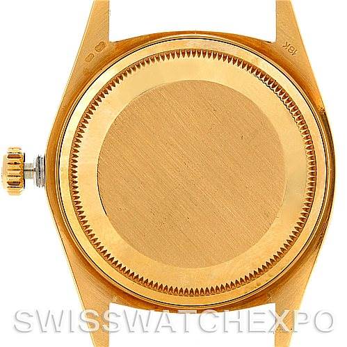 This image shows the caseback and crown of a Rolex President 18078 Men's Yellow Gold Champagne Dial 18078 Men's Yellow Gold Champagne Dial model watch from a rear angle.