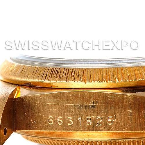 This close-up image of the Rolex President 18078 Men's Yellow Gold Champagne Dial 18078 Men's Yellow Gold Champagne Dial model shows the side of the watch case, bezel, and engraved serial number.