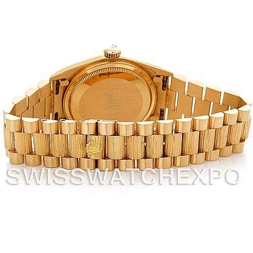 The image shows the back view and clasp of a Rolex President 18078 Men's Yellow Gold Champagne Dial 18078 Men's Yellow Gold Champagne Dial model watch, highlighting its gold bracelet and case back.