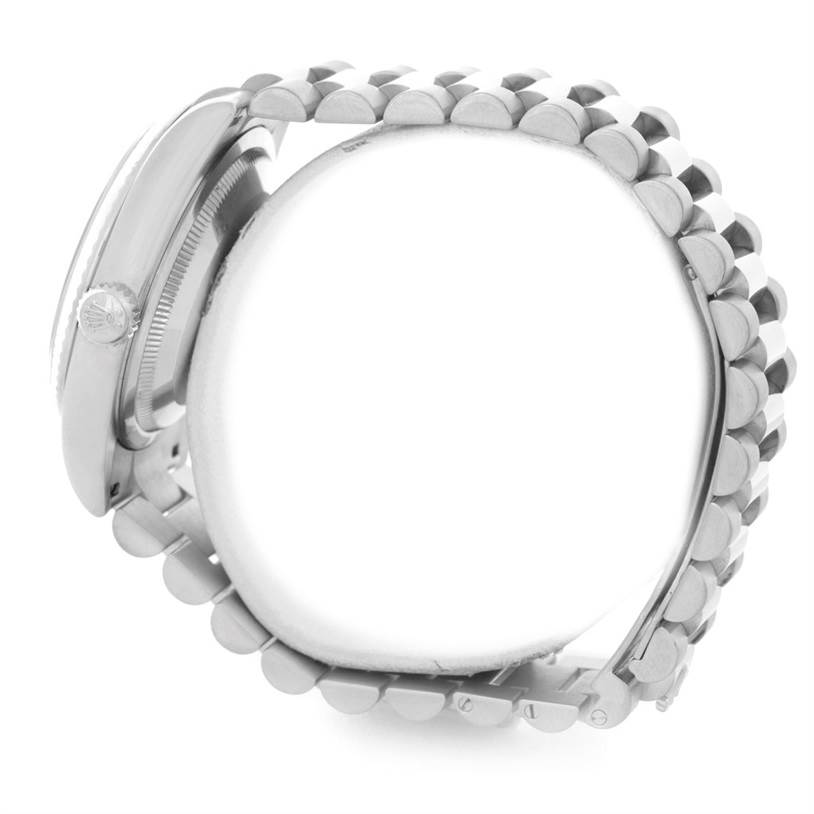 This side view of the Rolex President 118239 Men's White Gold Black Dial 118239 Men's White Gold Black Dial model shows the watch's crown and bracelet.