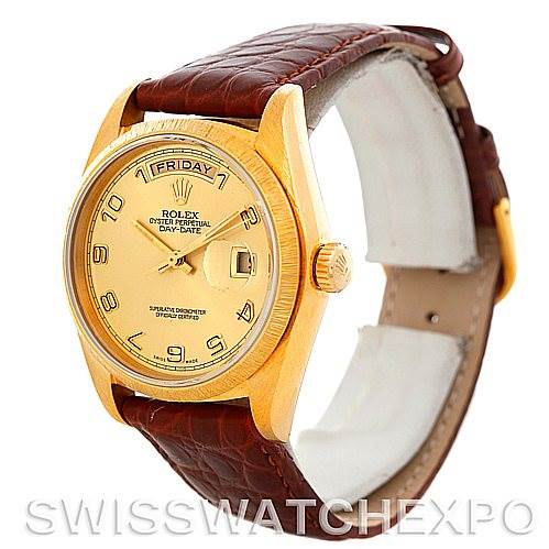 This Rolex President 18078 Men's Yellow Gold Champagne Dial 18078 Men's Yellow Gold Champagne Dial model watch is shown at an angle displaying the face, bezel, crown, and leather strap.