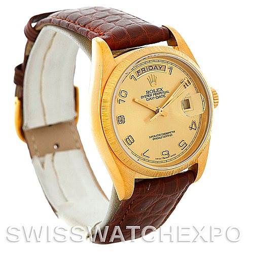 The image shows a side angle of a Rolex President 18078 Men's Yellow Gold Champagne Dial 18078 Men's Yellow Gold Champagne Dial model watch, highlighting its dial, bezel, and brown leather strap.