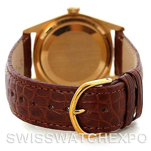 This image shows the back and band of a Rolex President 18078 Men's Yellow Gold Champagne Dial 18078 Men's Yellow Gold Champagne Dial watch, focusing on the brown leather strap and gold buckle.