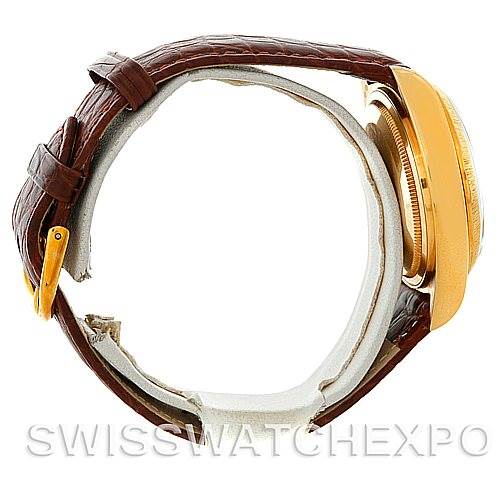 The image shows a side view of a Rolex President 18078 Men's Yellow Gold Champagne Dial 18078 Men's Yellow Gold Champagne Dial model watch, displaying the leather strap and the gold case.