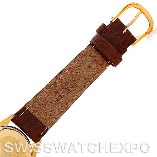The image shows the back of a leather strap and buckle of a Rolex President 1005 Men's Yellow Gold Silver Dial 1005 Men's Yellow Gold Silver Dial model watch.