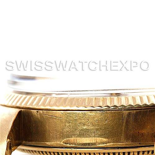 This close-up image of a Rolex President 1005 Men's Yellow Gold Silver Dial 1005 Men's Yellow Gold Silver Dial model watch shows the side of the case and bezel, partly capturing the lugs and bracelet.