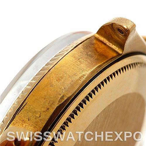 This close-up shows the side of a Rolex President 1005 Men's Yellow Gold Silver Dial 1005 Men's Yellow Gold Silver Dial watch, including the case and part of the bezel.
