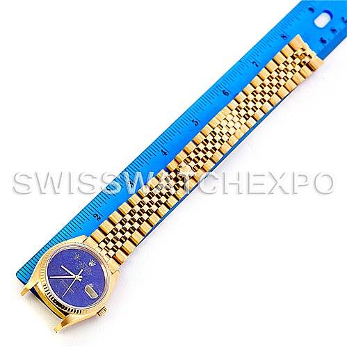 The image shows a Rolex President 16018 Men's Yellow Gold Blue Dial 16018 Men's Yellow Gold Blue Dial watch laid flat next to a blue ruler, showcasing the face and full length of the gold bracelet.
