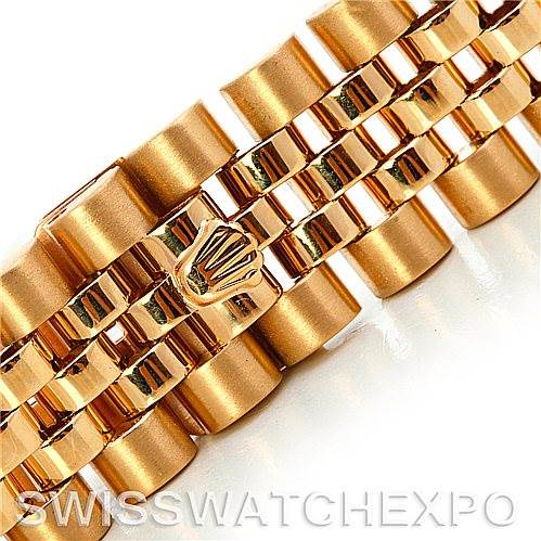 This image shows a close-up angle of the bracelet links and the iconic Rolex crown clasp of a Rolex President 16018 Men's Yellow Gold Blue Dial 16018 Men's Yellow Gold Blue Dial model.