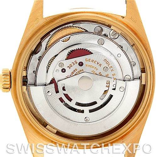 The image shows the case back removed, exposing the movement of the Rolex President 16018 Men's Yellow Gold Blue Dial 16018 Men's Yellow Gold Blue Dial model watch.