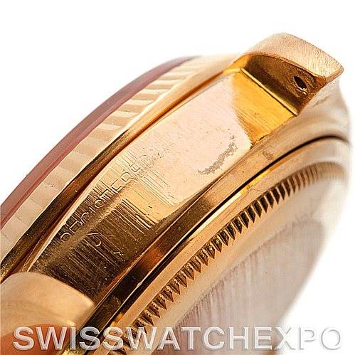 This close-up image shows a portion of the case and bezel of a Rolex President 18038 Men's Yellow Gold Champagne Dial 18038 Men's Yellow Gold Champagne Dial model watch.