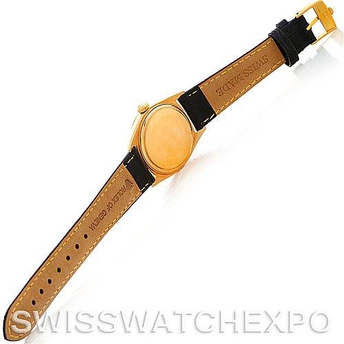 This image shows the back view of a Rolex President 1803 Men's Yellow Gold Champagne Dial 1803 Men's Yellow Gold Champagne Dial model watch, displaying its leather strap and gold case.