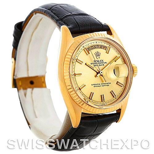 The image shows a Rolex President 1803 Men's Yellow Gold Champagne Dial 1803 Men's Yellow Gold Champagne Dial model watch, highlighting its gold case, fluted bezel, dial with day and date display, and black leather strap at a three-quarter angle.