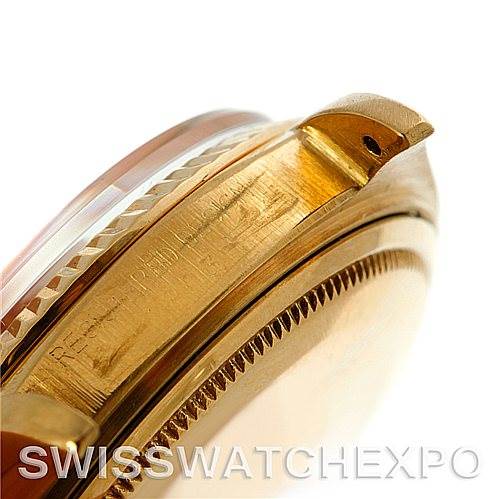 Close-up of the side profile and lugs of a Rolex President 1803 Men's Yellow Gold Champagne Dial 1803 Men's Yellow Gold Champagne Dial model watch, showing part of the bezel and engraving.