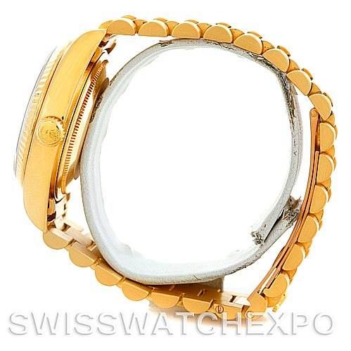 This image shows a side view of a Rolex President 18038 Men's Yellow Gold Champagne Dial 18038 Men's Yellow Gold Champagne Dial model watch, highlighting its crown, case, and bracelet.